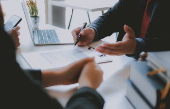 Lawyer during a meeting with a client at a legal office.