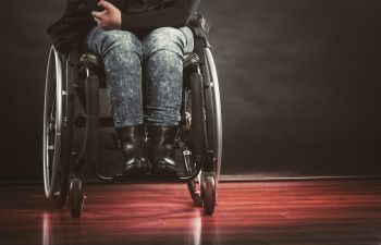 A disabled person in a wheelchair